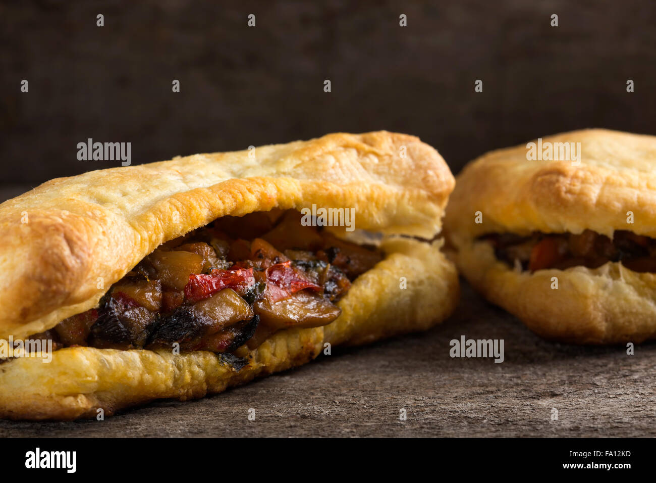 Puff pastry stuffed with mushrooms and vegetables Stock Photo