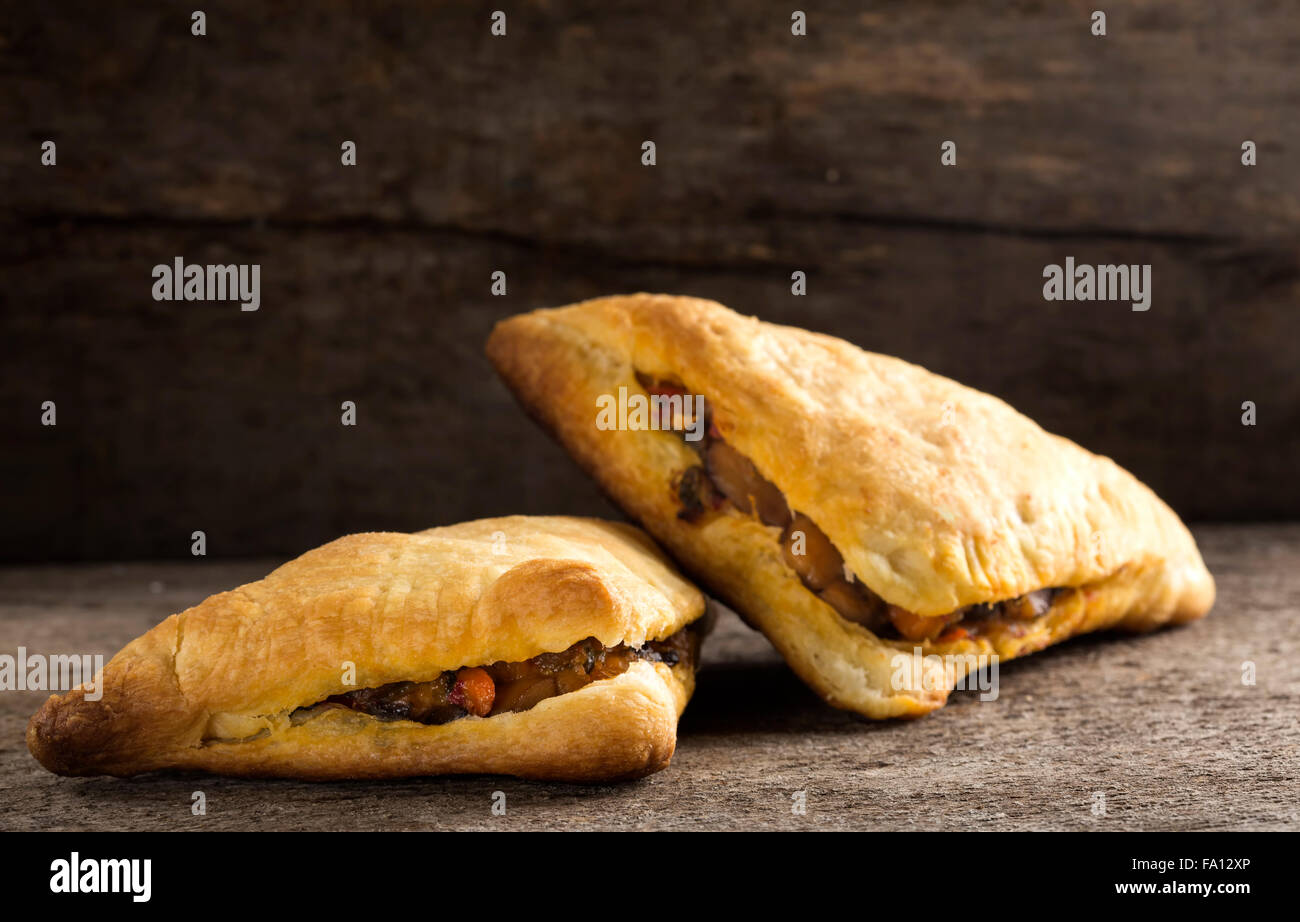 Puff pastry stuffed with mushrooms and vegetables Stock Photo