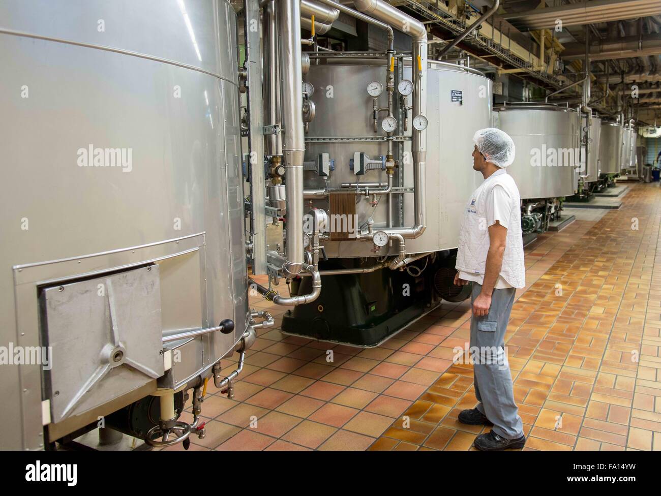 An employee of chocolate manufacturer Ritter Sport checks the