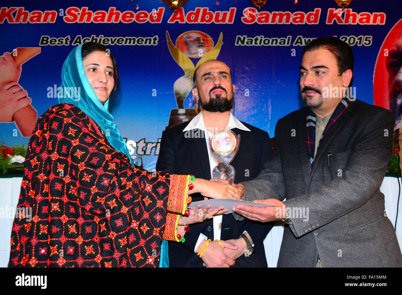 Quetta, Pakistan. 19th Dec, 2015. Provincial Ministers for health giving the “Khan Shaheed Samad Khan Achakzai best achievement national award” to Sana Durrani in category of social work. Credit:  Din Muhammad Watanpaal/Alamy Live News Stock Photo