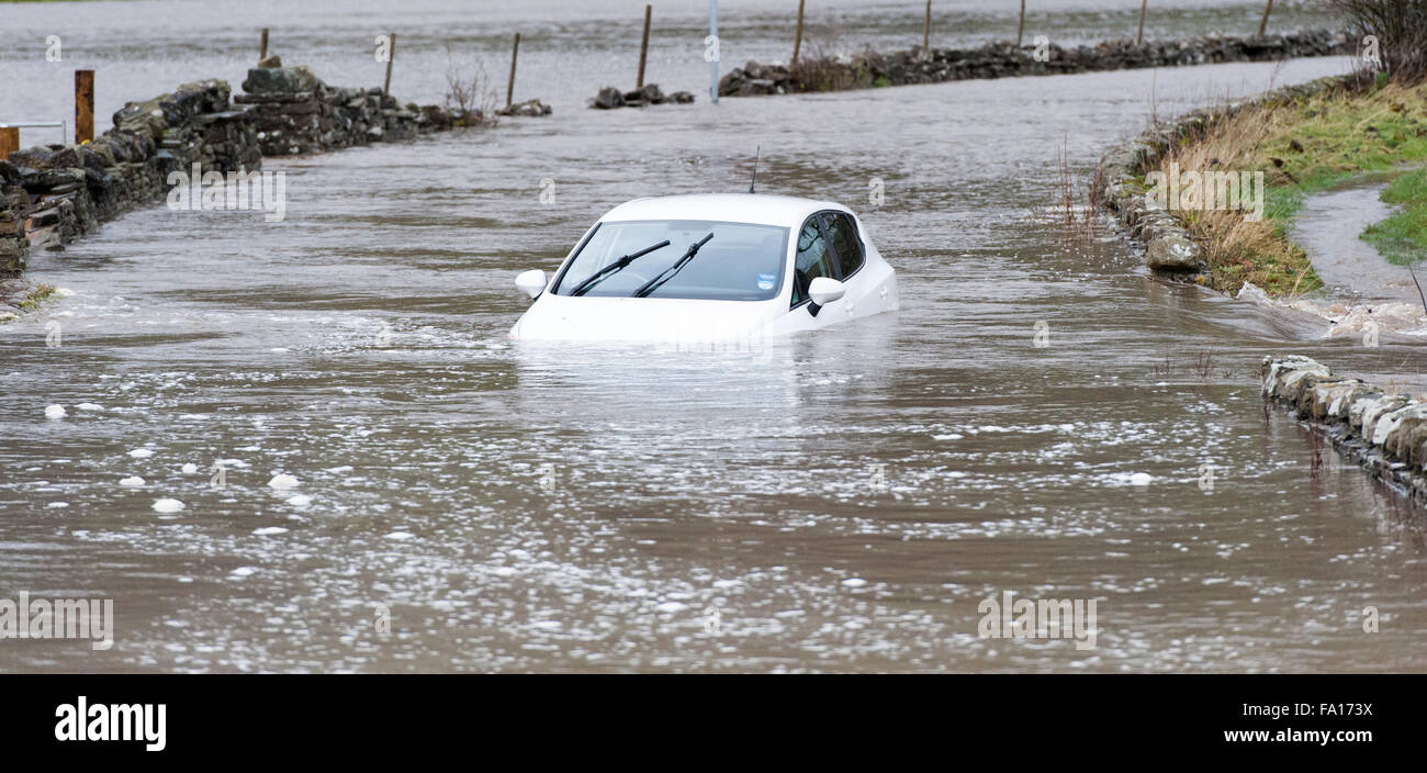 A car caught up in the flooding around Hawes, Wensleydale in North Yorkshire. The second time flooding has hit the are in the pa Stock Photo