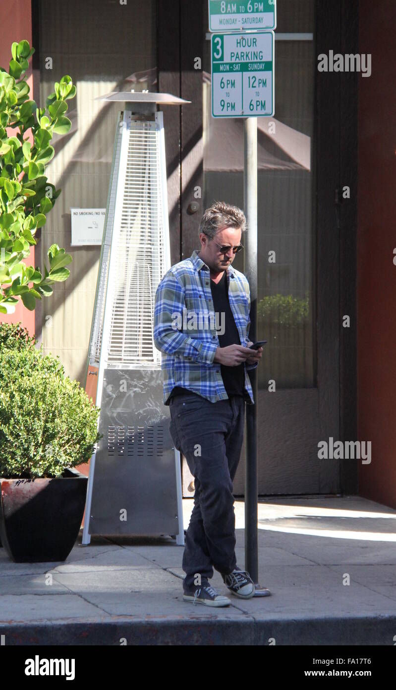 Matthew Perry seen using his phone whilst he wait for his Audi car  Featuring: Matthew Perry Where: Beverly Hills, California, United States When: 18 Nov 2015 Stock Photo