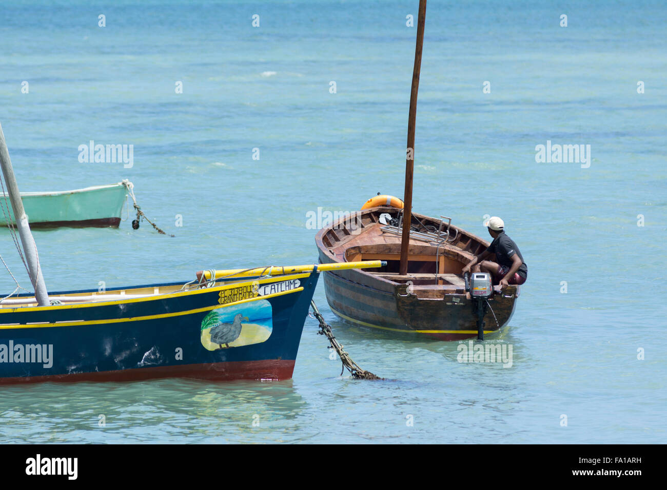 A local Mauritian taking his boat out towards the ocean Stock Photo