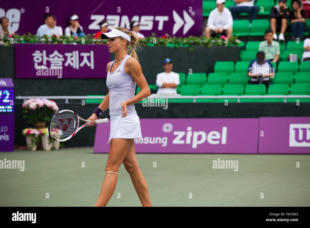 Russian professional women's tennis player, Maria Kirilenko walks away from the play during a lull at the Hansol Korea Open Stock Photo