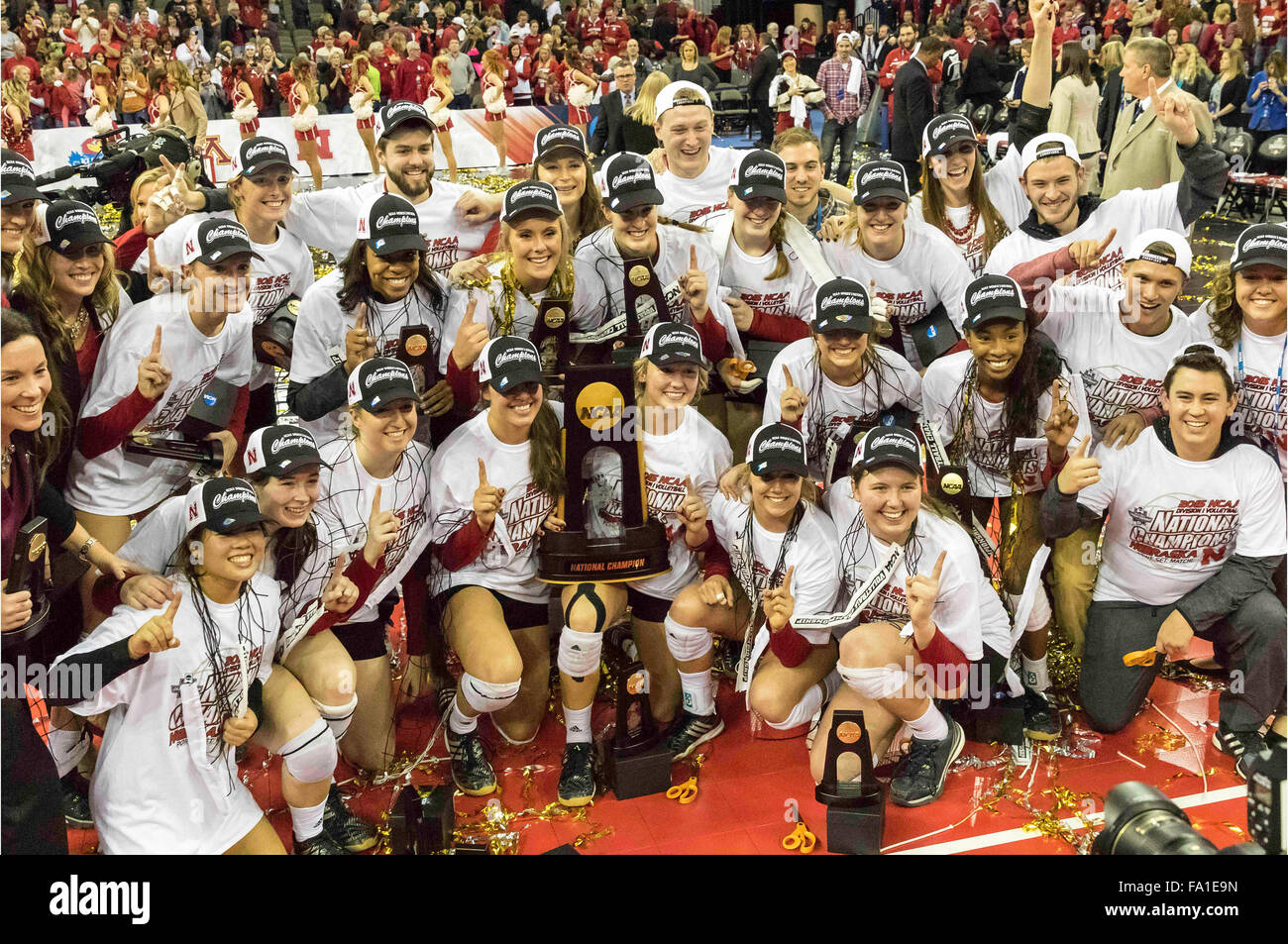 Omaha, NE. USA. 19th Dec, 2015. Nebraska players pose with their trophy after the 2015 NCAA D1
