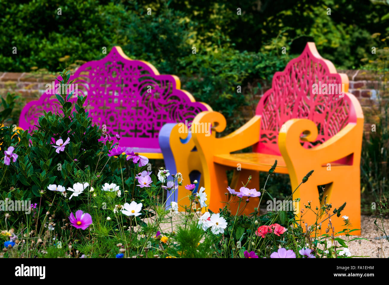 Wildflower garden and benches outdoor relaxing space Stock Photo