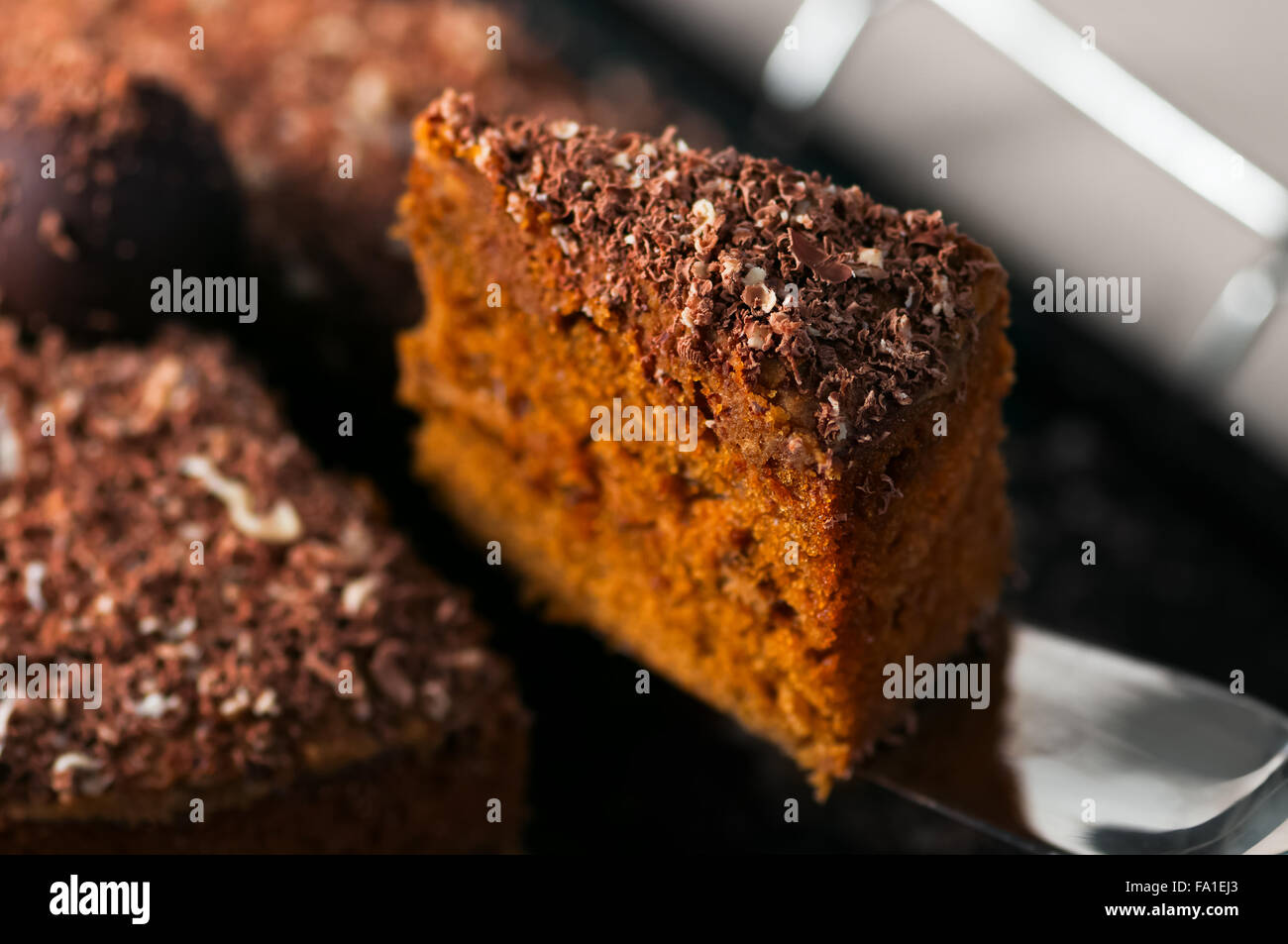 Chocolate truffle carrot cake slice closeup Stock Photo