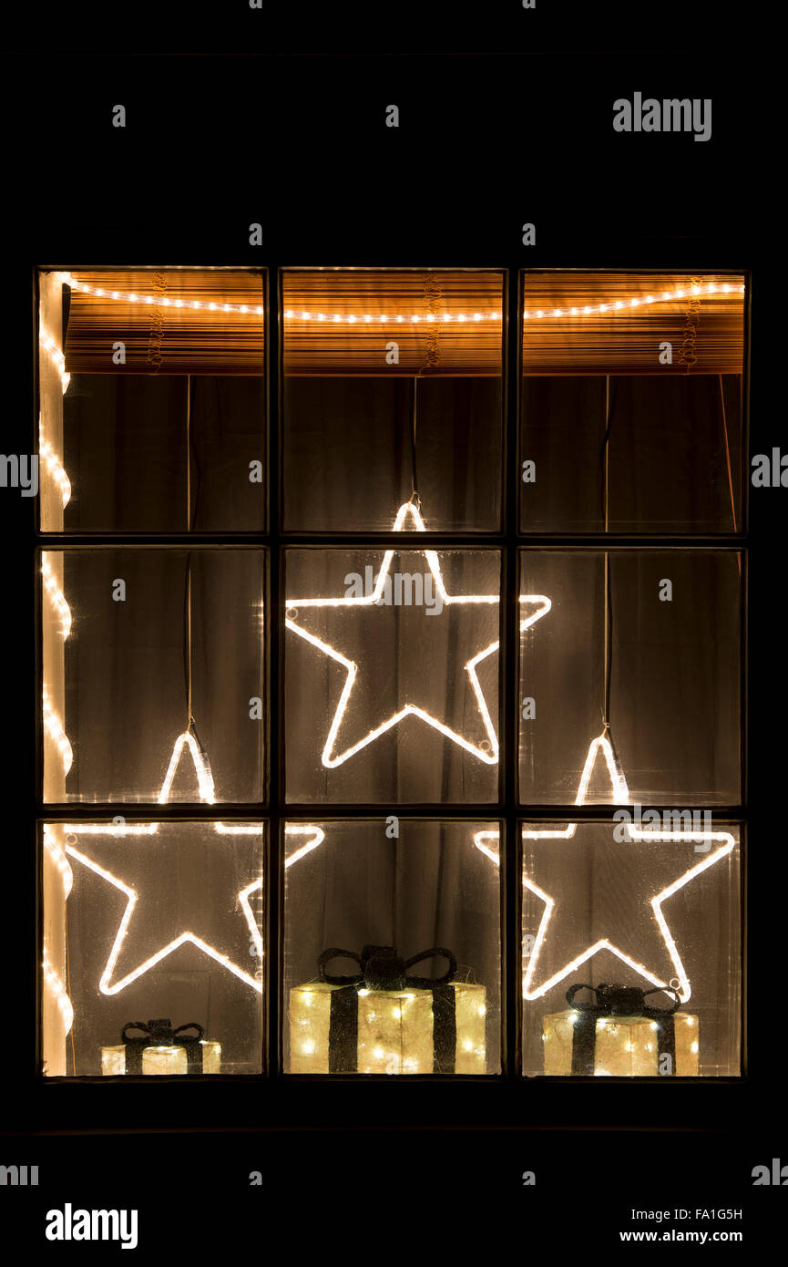 Festive Christmas house window display. Stars and Gifts. Oxfordshire, England Stock Photo