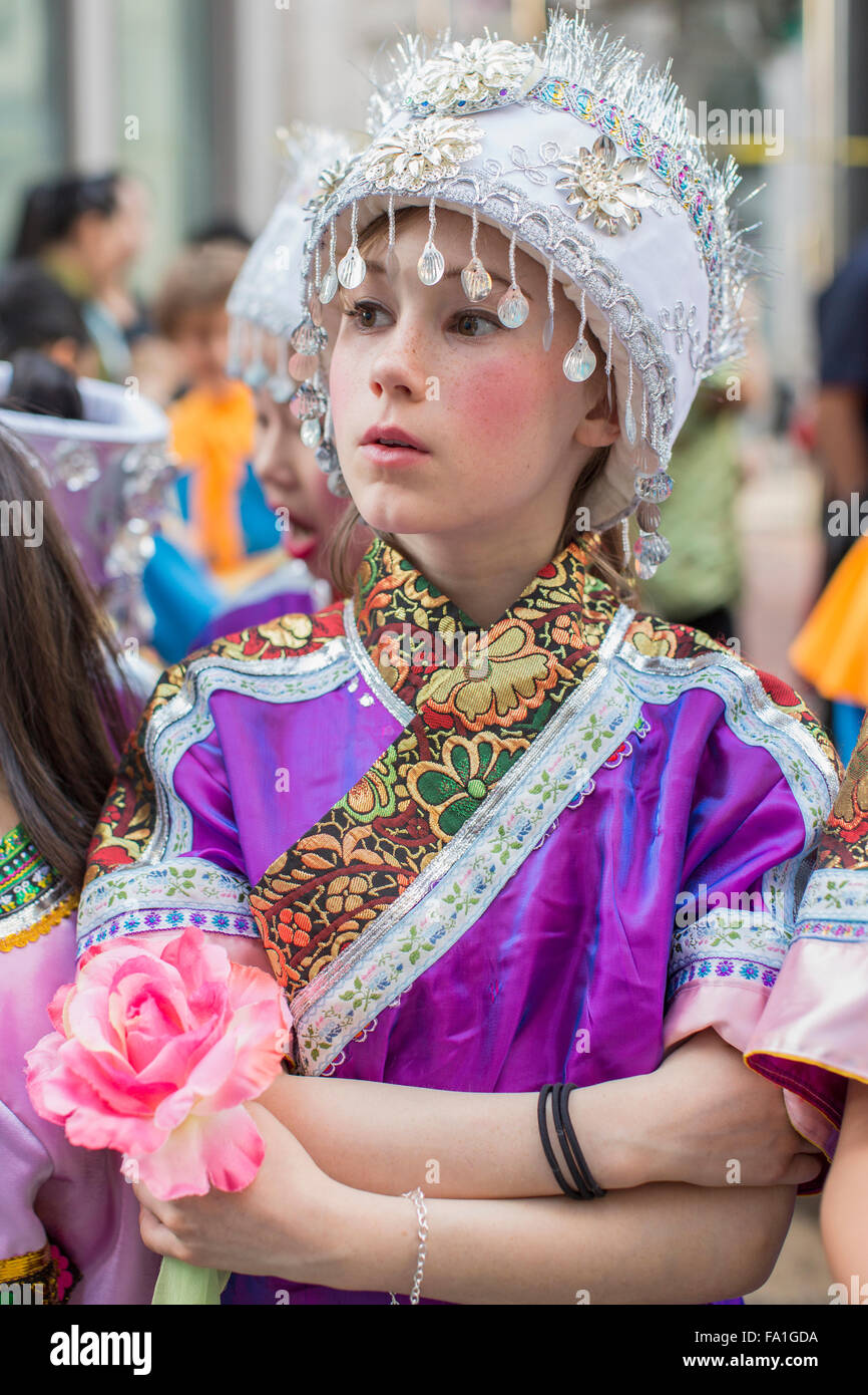 Young girl dressed in elaborate, colorful costume at San Francisco Chinese New Year parade. Stock Photo