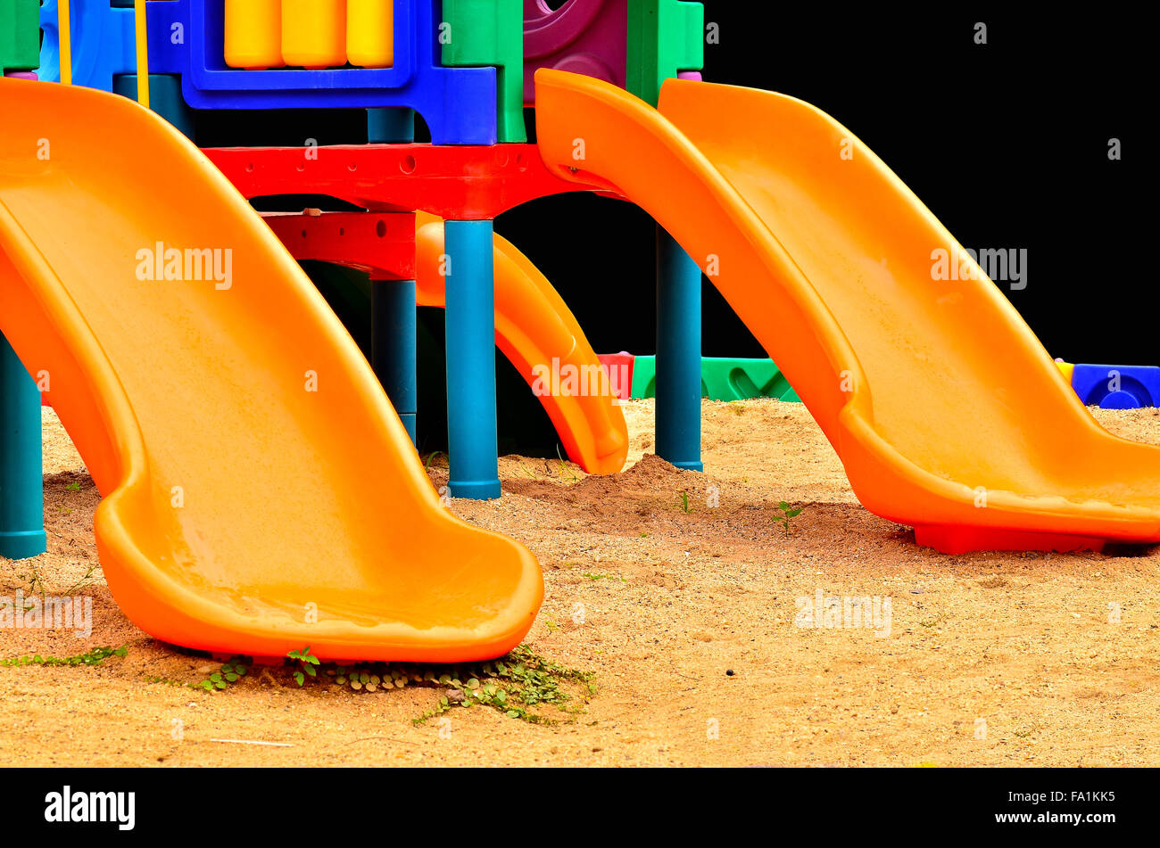 Children's slides of plastic isolated on black Stock Photo Alamy