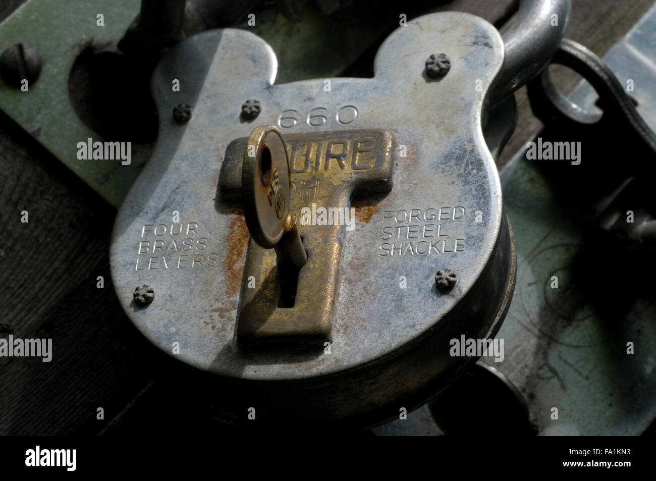 Padlock open with a key in it Stock Photo Alamy