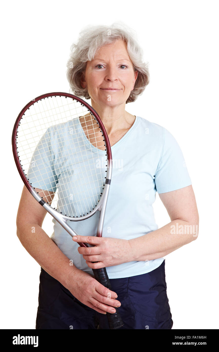 Smiling elderly woman holding a tennis racket Stock Photo