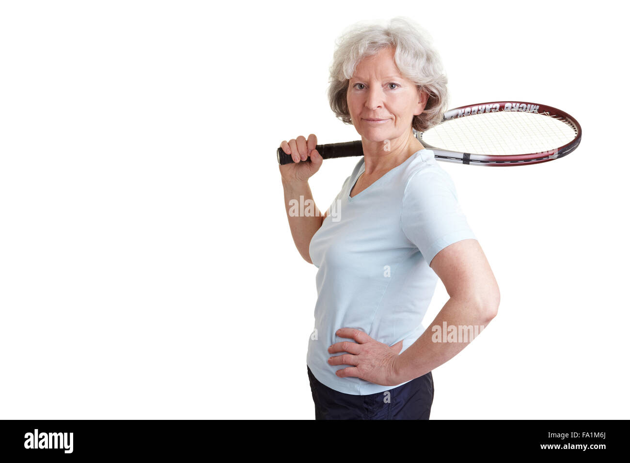 Happy senior woman with a tennis racket Stock Photo