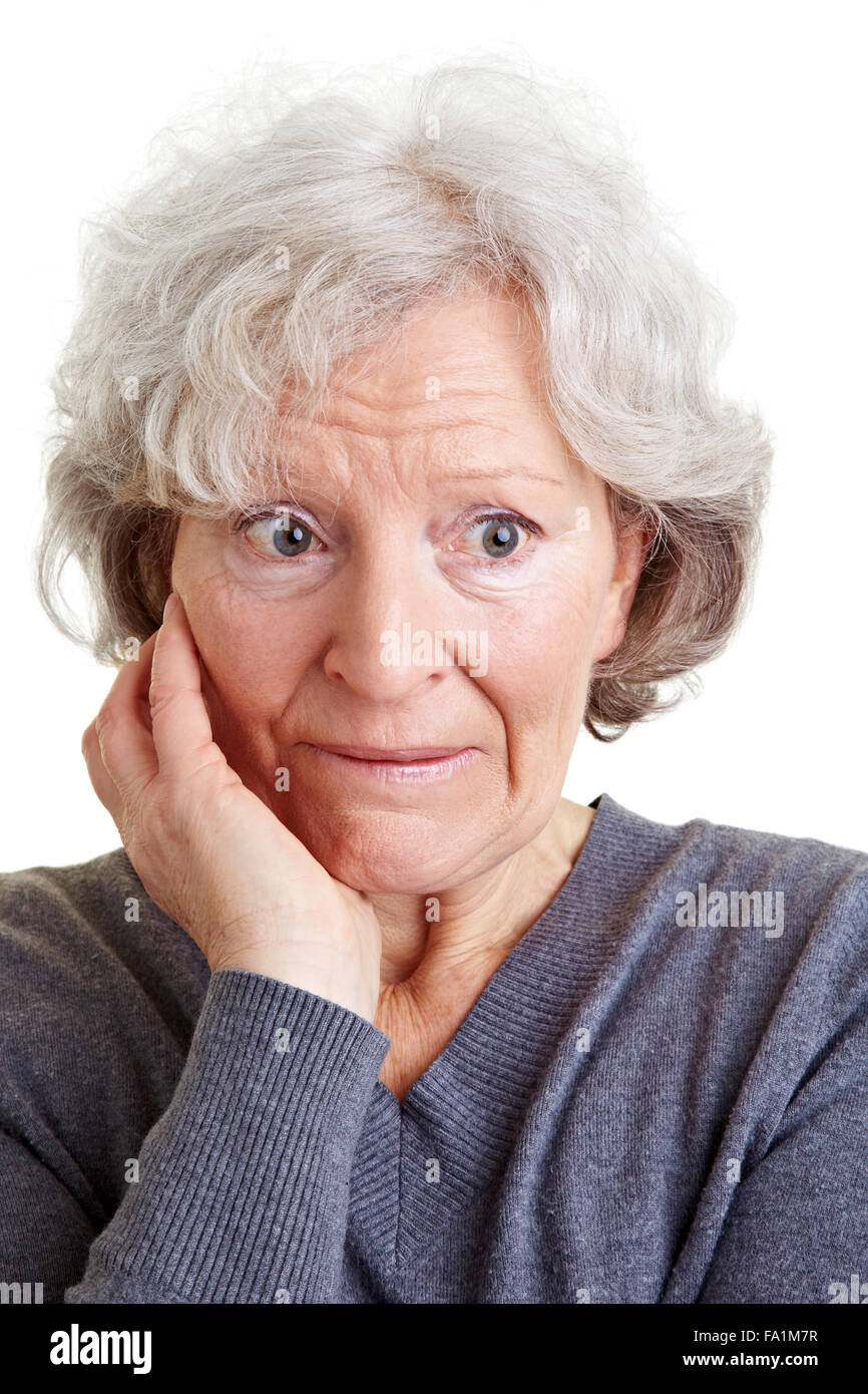 Embarrassed old senior woman looking shy to the side Stock Photo