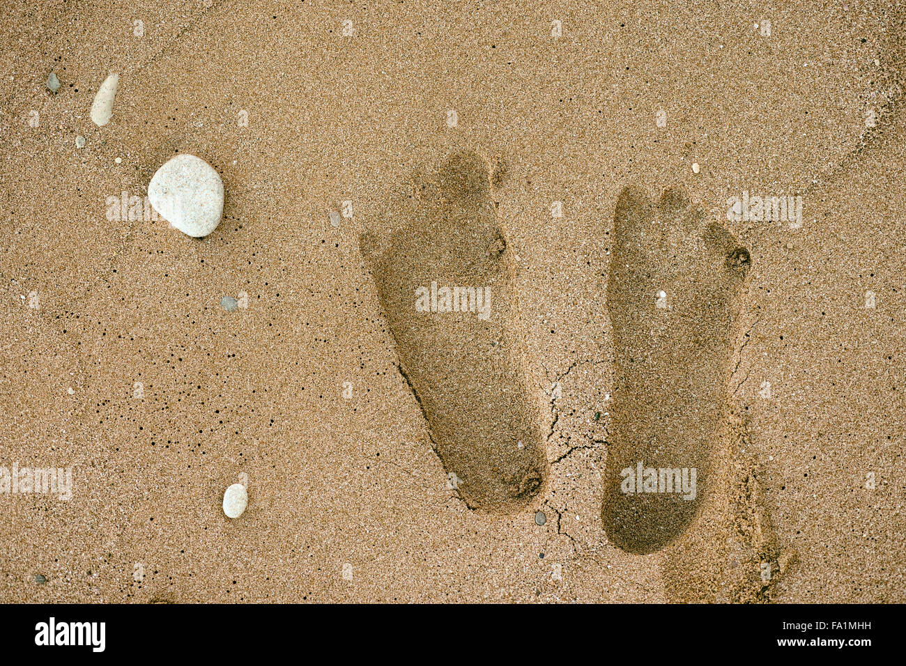 Human footprints on the sand. Close up. Stock Photo