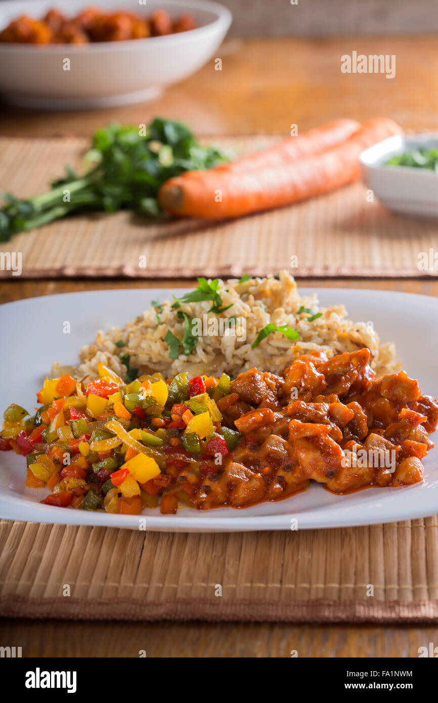 Sweet and sour chicken and rice with vegetables Stock Photo