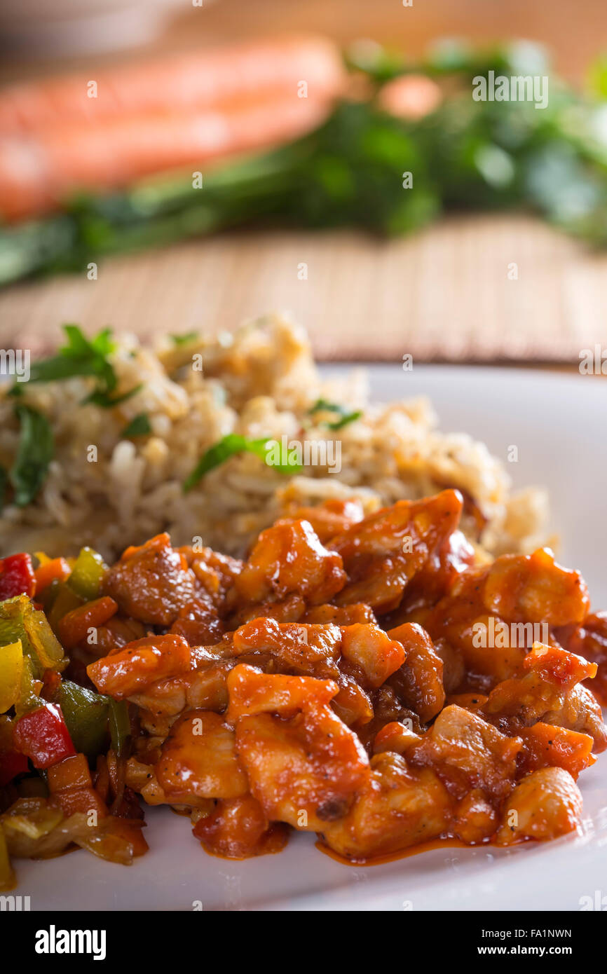 Sweet and sour chicken and rice with vegetables Stock Photo