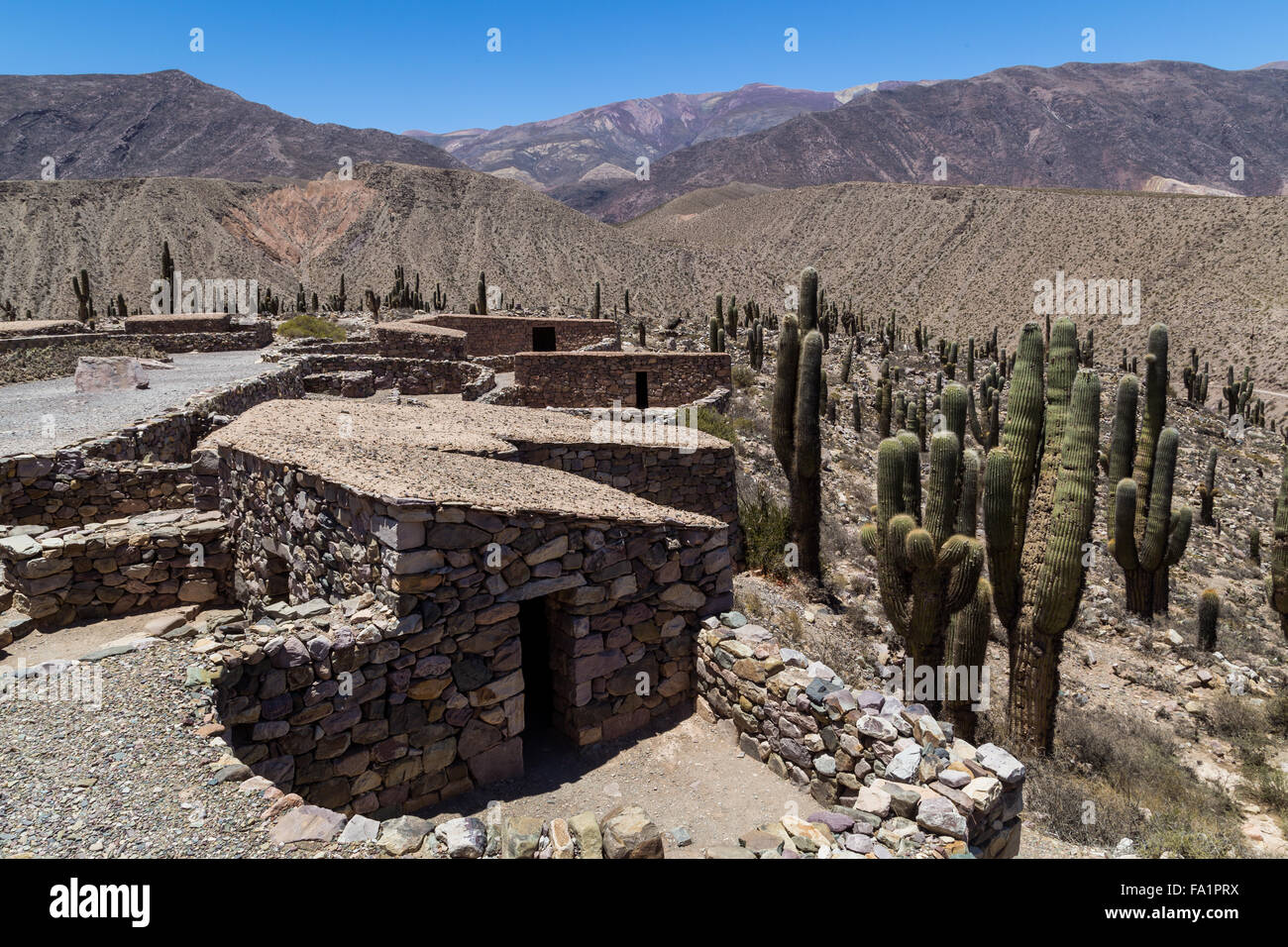 Reconstructed stone huts at the pre-inca fortress Pucara de Tilcara in Northwest Argentina. Stock Photo