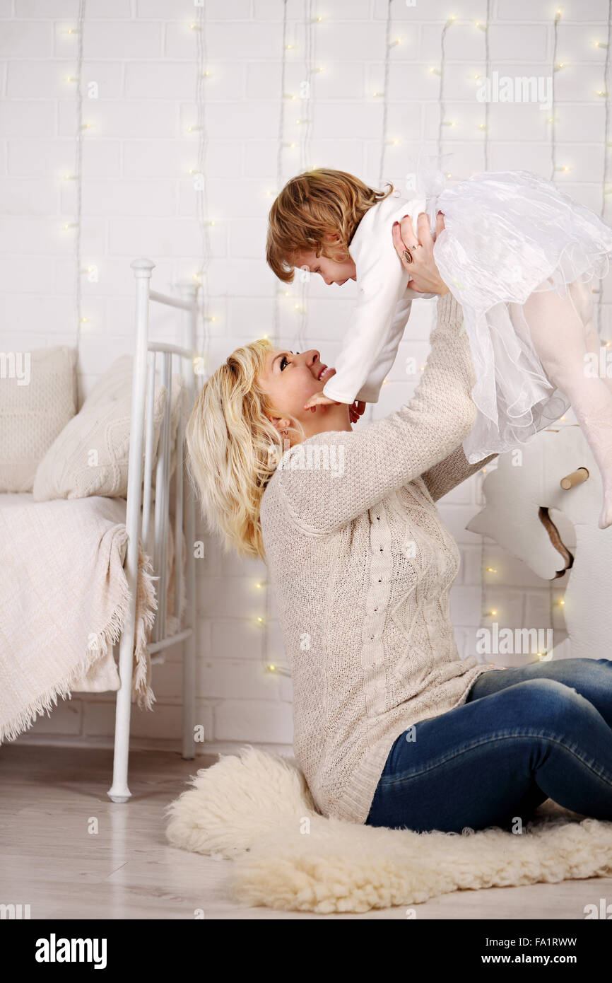 Mom throws daughter up Stock Photo Alamy