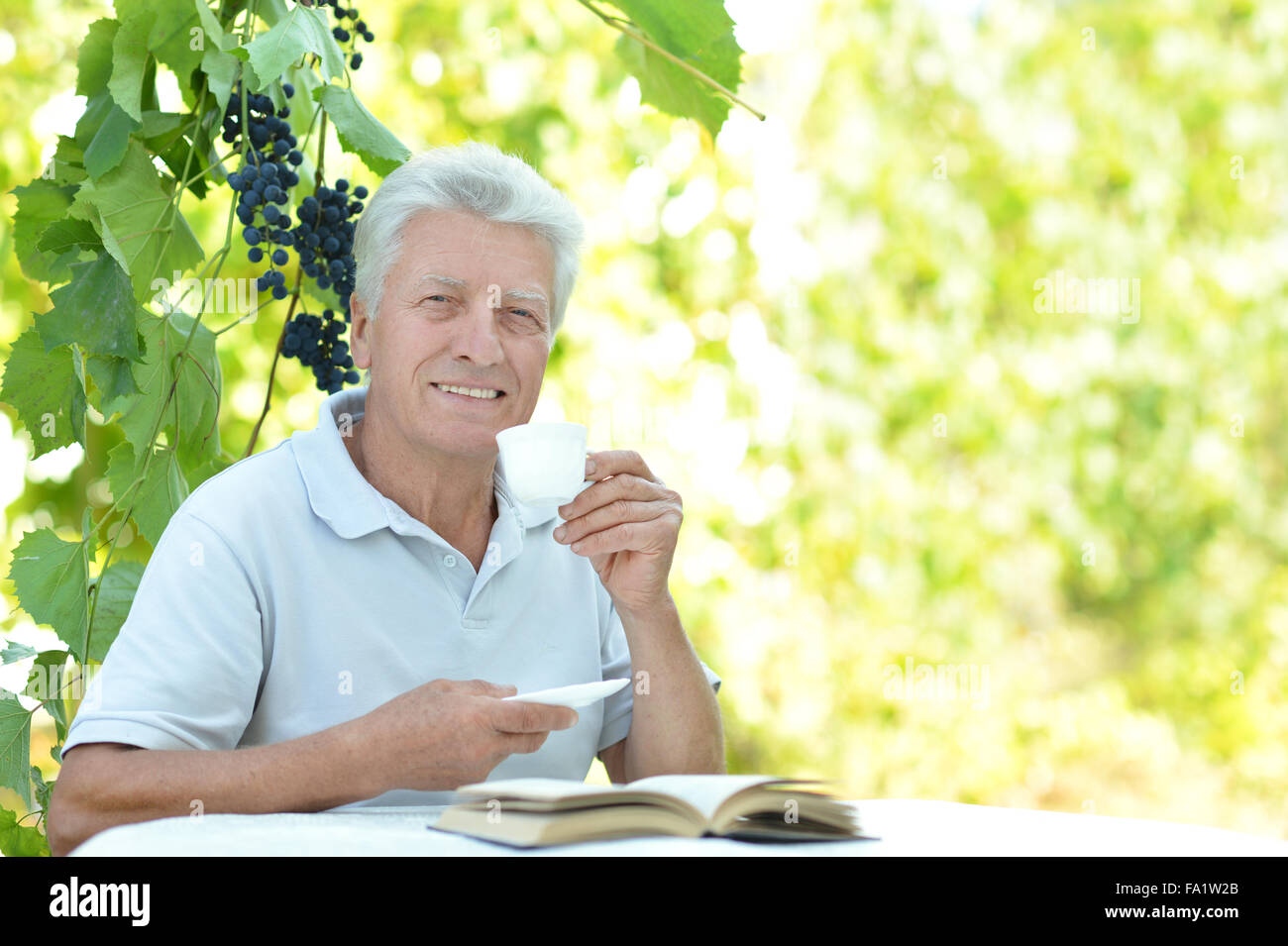 Elderly man with cup of coffee Stock Photo Alamy