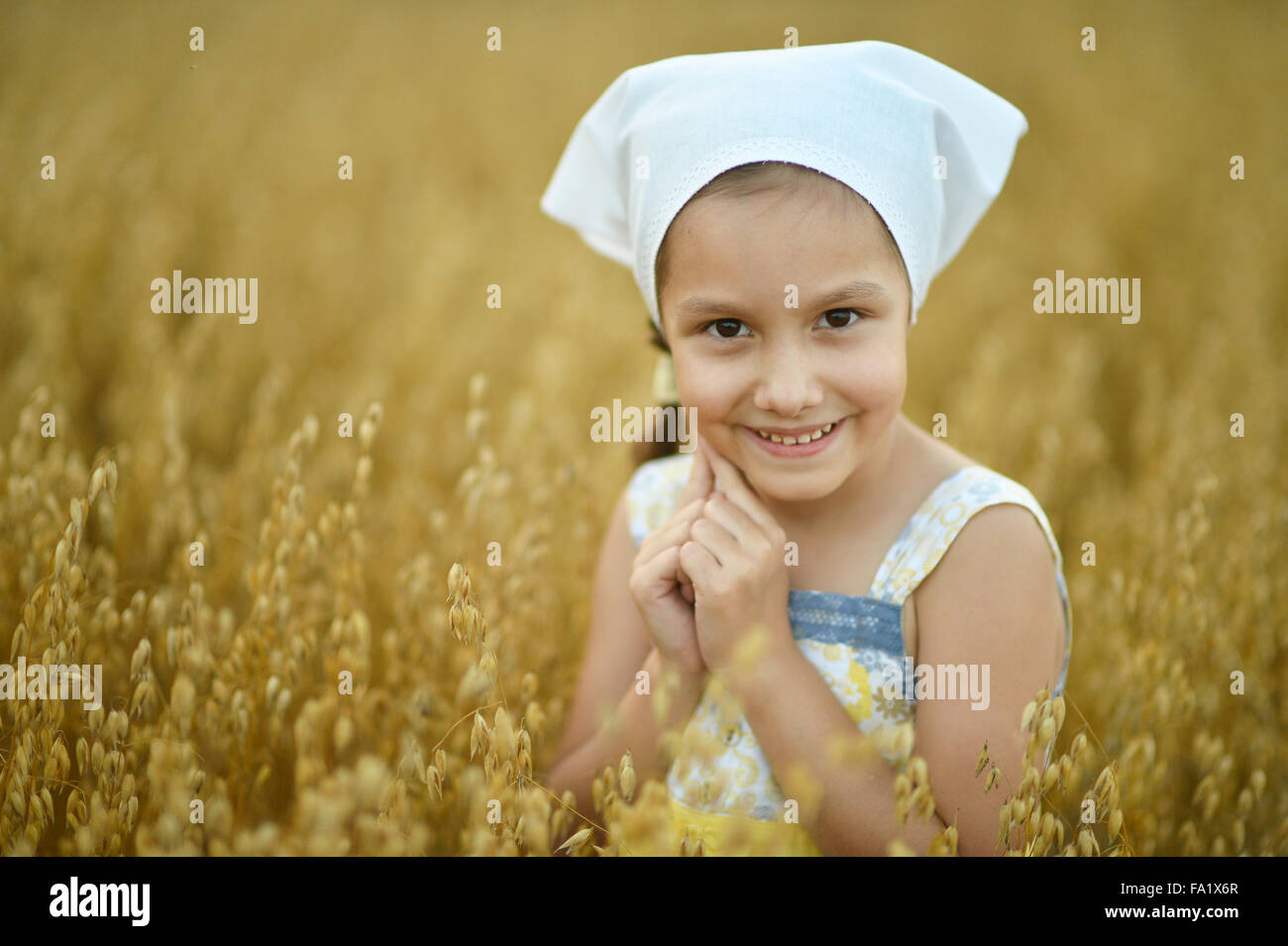 Little girl in wheat field Stock Photo - Alamy