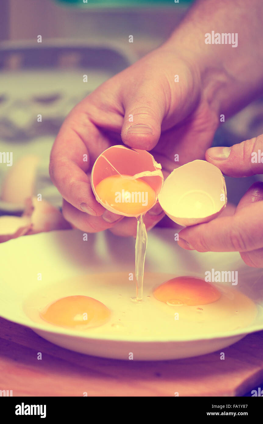 hen egg separating the yolk Stock Photo Alamy