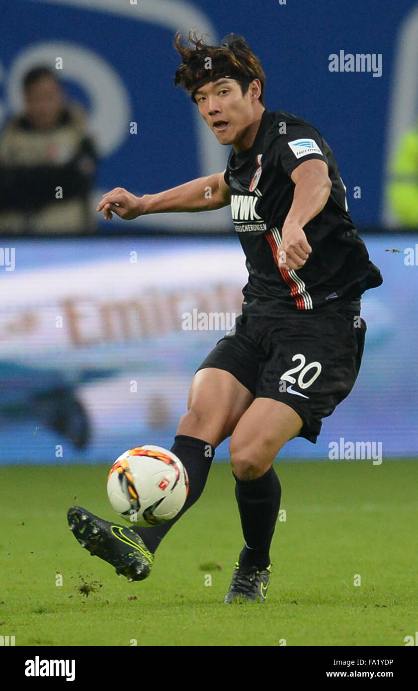 Hamburg, Germany. 19th Dec, 2015. Augsburg's Jeong-Ho Hong in action during the German Bundesliga soccer match between Hamburg SV and FC Augsburg at Volksparkstadion in Hamburg, Germany, 19 December 2015. Photo: DANIEL BOCKWOLDT/dpa (EMBARGO CONDITIONS - ATTENTION: Due to the accreditation guidelines, the DFL only permits the publication and utilisation of up to 15 pictures per match on the internet and in online media during the match.)/dpa/Alamy Live News Stock Photo