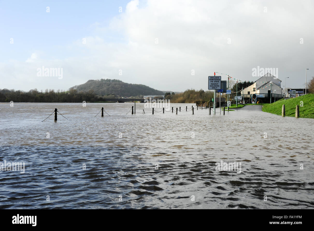 South Wales, UK, Sunday 20th December 2015. The river Towy bursts its banks on Carmarthen quayside and floods the low lying surrounding land following prolonged heavy rain during Saturday in Carmarthenshire, west Wales UK. View overlooking river Towy from The Quay. Credit:  Algis Motuza/Alamy Live News Stock Photo