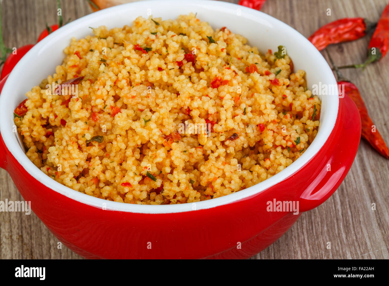 Arabic traditional cuisine Couscous with tomato and green onion Stock