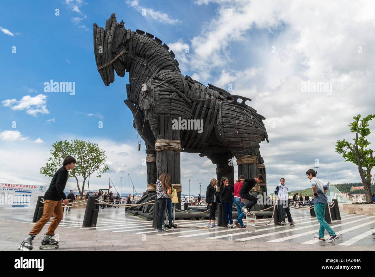 A group of boys and girls play near the movie-famous Trojan Horse on April 19, 2014 in Canakkale, Turkey. Stock Photo