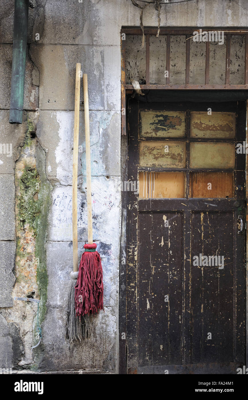 Typical Chinese brooms hanging at the wall of a house in Wuzhen, China Stock Photo