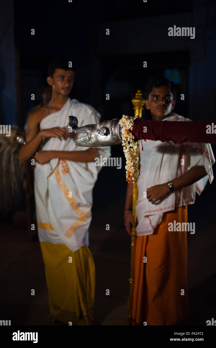 Indian brahmin boys in finest robes, clothes assisting in the blessing of a house by carrying a palanquin during a monthly hindu Stock Photo