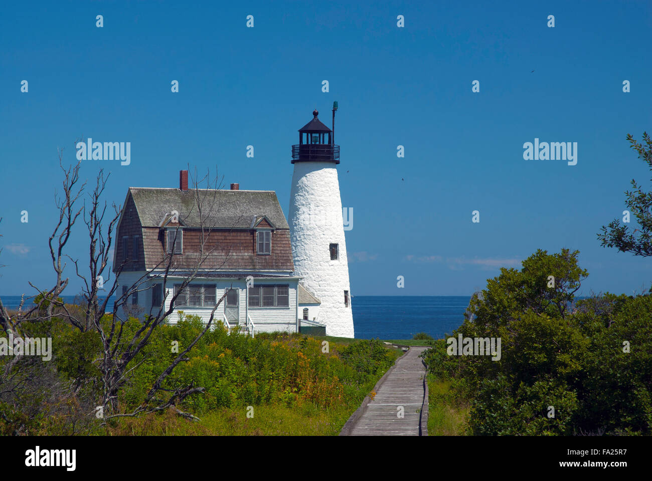Wood Island lighthouse is a popular tourist attraction during the summer months. He beacon has multiple historic accounts of hauntings and rescues. Stock Photo