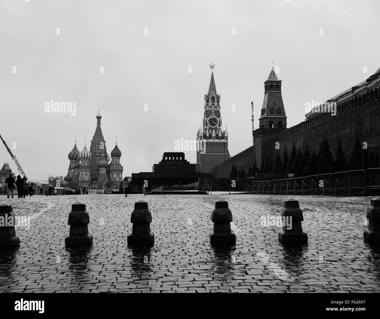 Black and white picture of Red Square in Moscow with Spasskaya tower, Lenin's mausoleum, and Saint Basil's Cathedral Stock Photo
