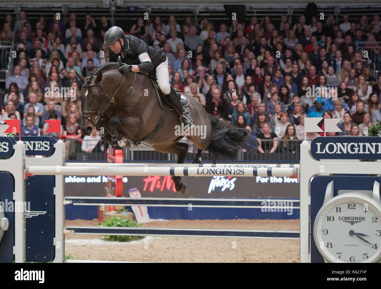 London UK. 20th December, 2015. The Longines FEI World Cup. John Whitaker (GBR) riding Argento @Julie Priestley/AlamyLiveNews Stock Photo