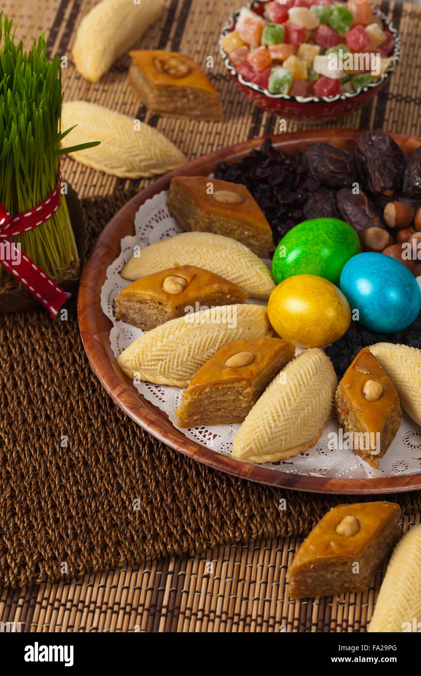 Colored eggs, wheat springs and candy on Nowruz holiday from Azerbaijan Stock Photo