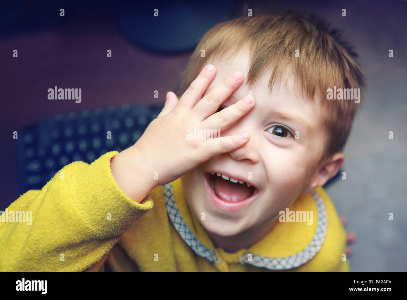 Portrait of cute boy looking at camera Stock Photo - Alamy