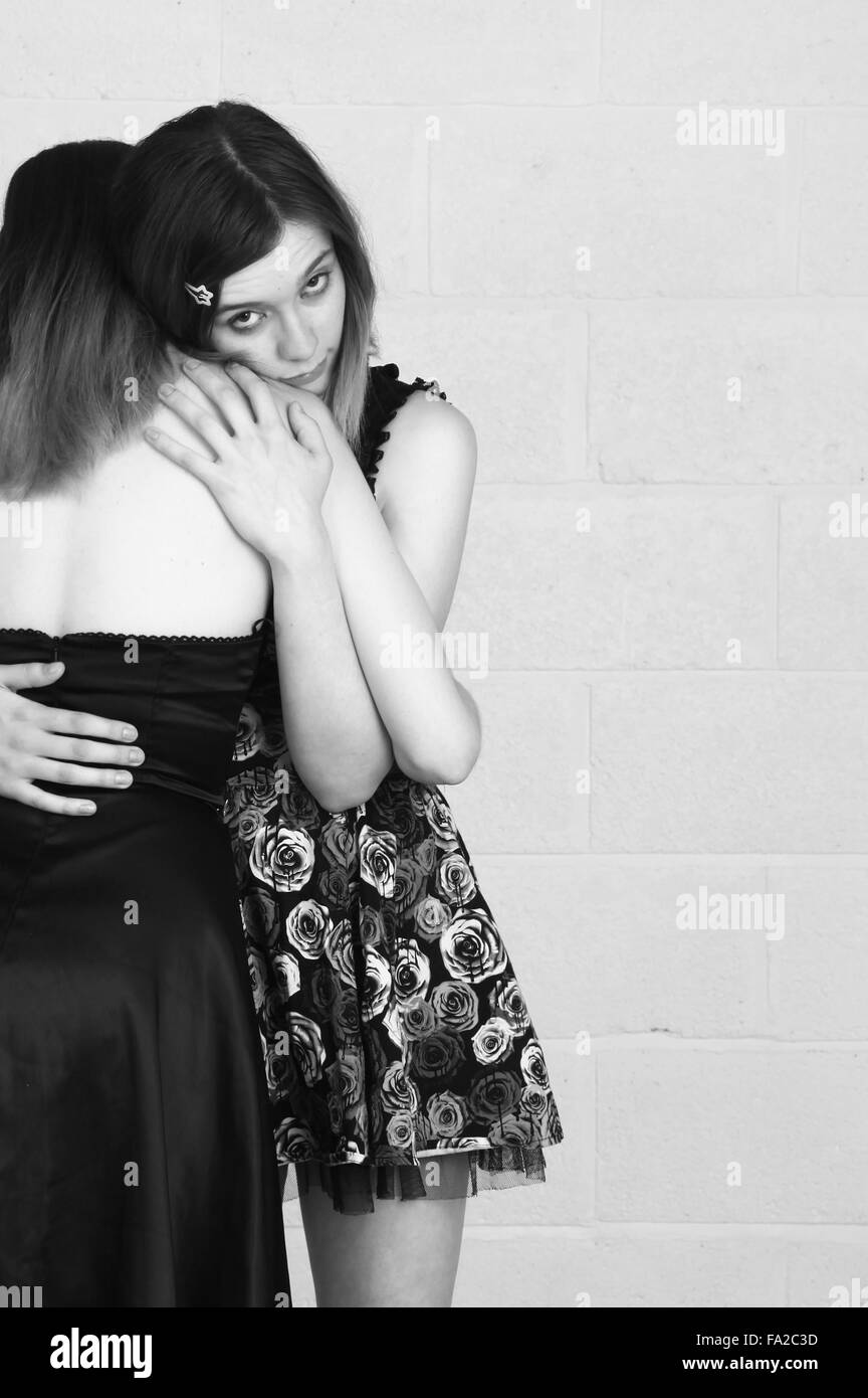 Two friends hugging each other Stock Photo - Alamy