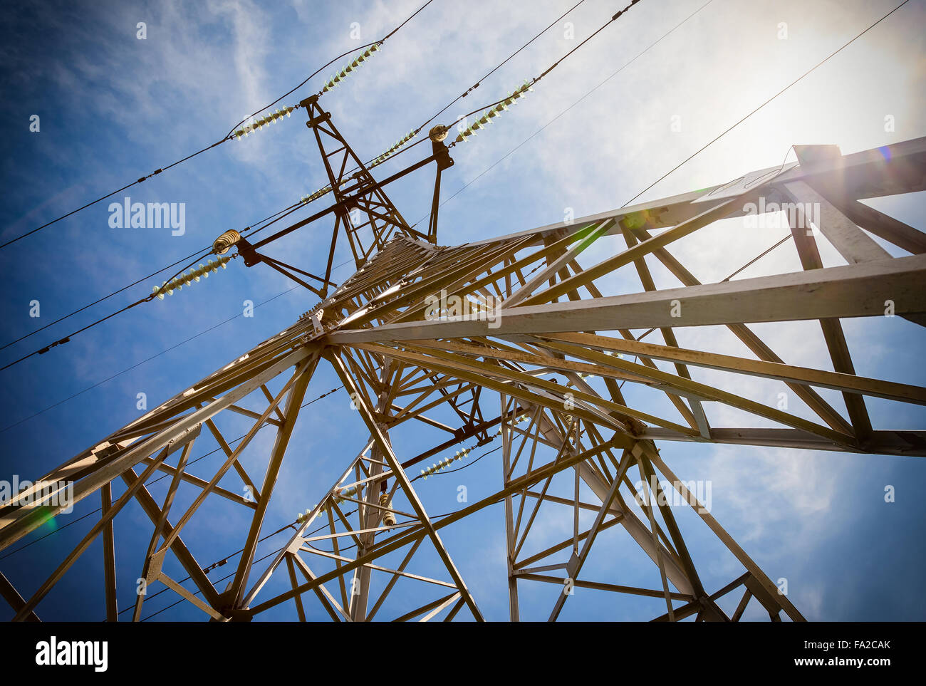 High voltage electric tower against the blue sky Stock Photo - Alamy