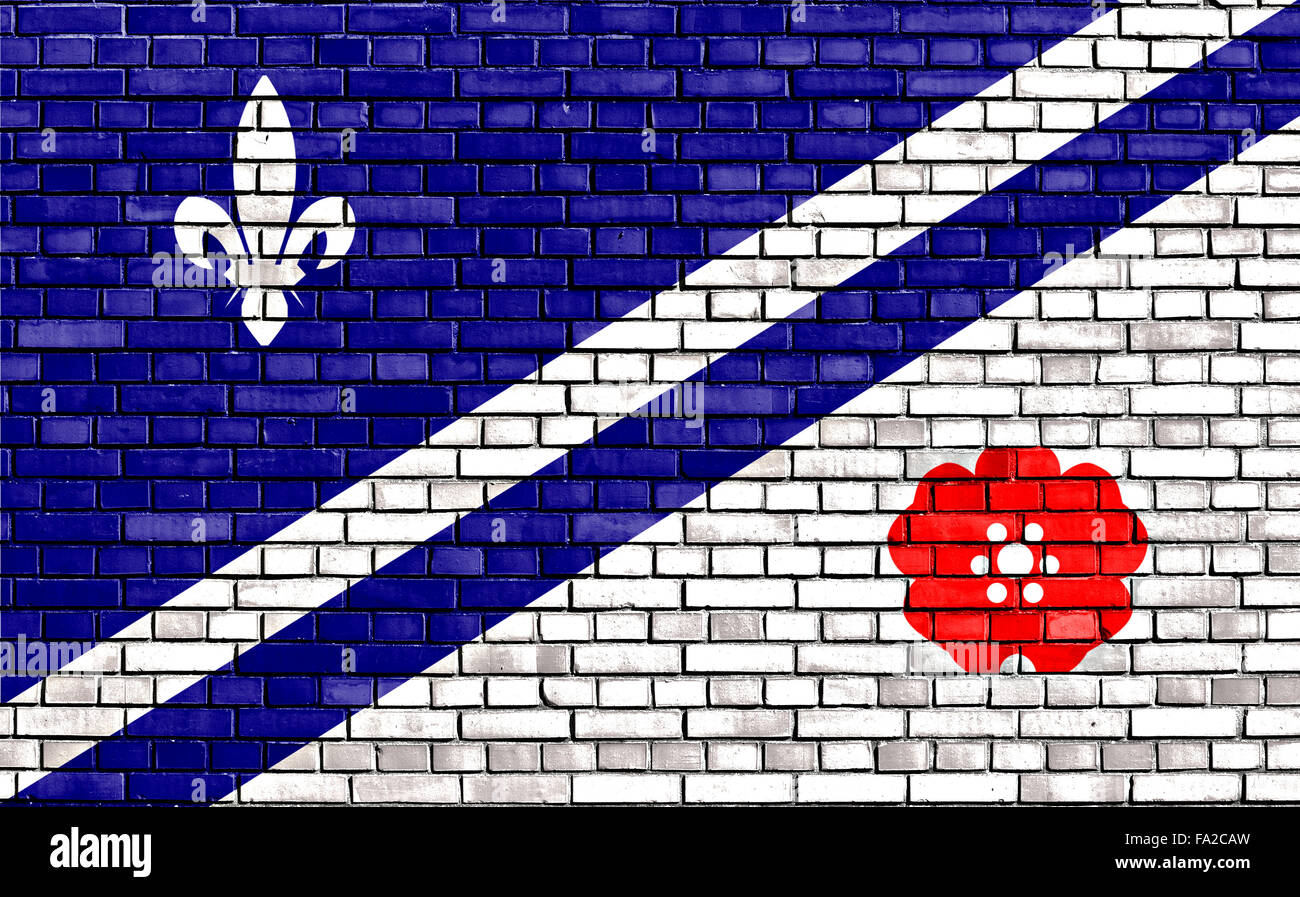 flag of Franco-Albertans painted on brick wall Stock Photo