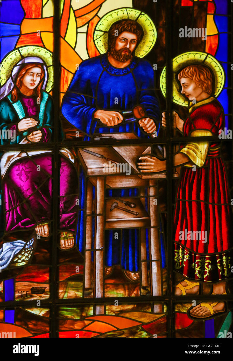 Stained Glass window depicting the Holy Family, Joseph, Mary and Jesus, in the Cathedral of Madrid Stock Photo