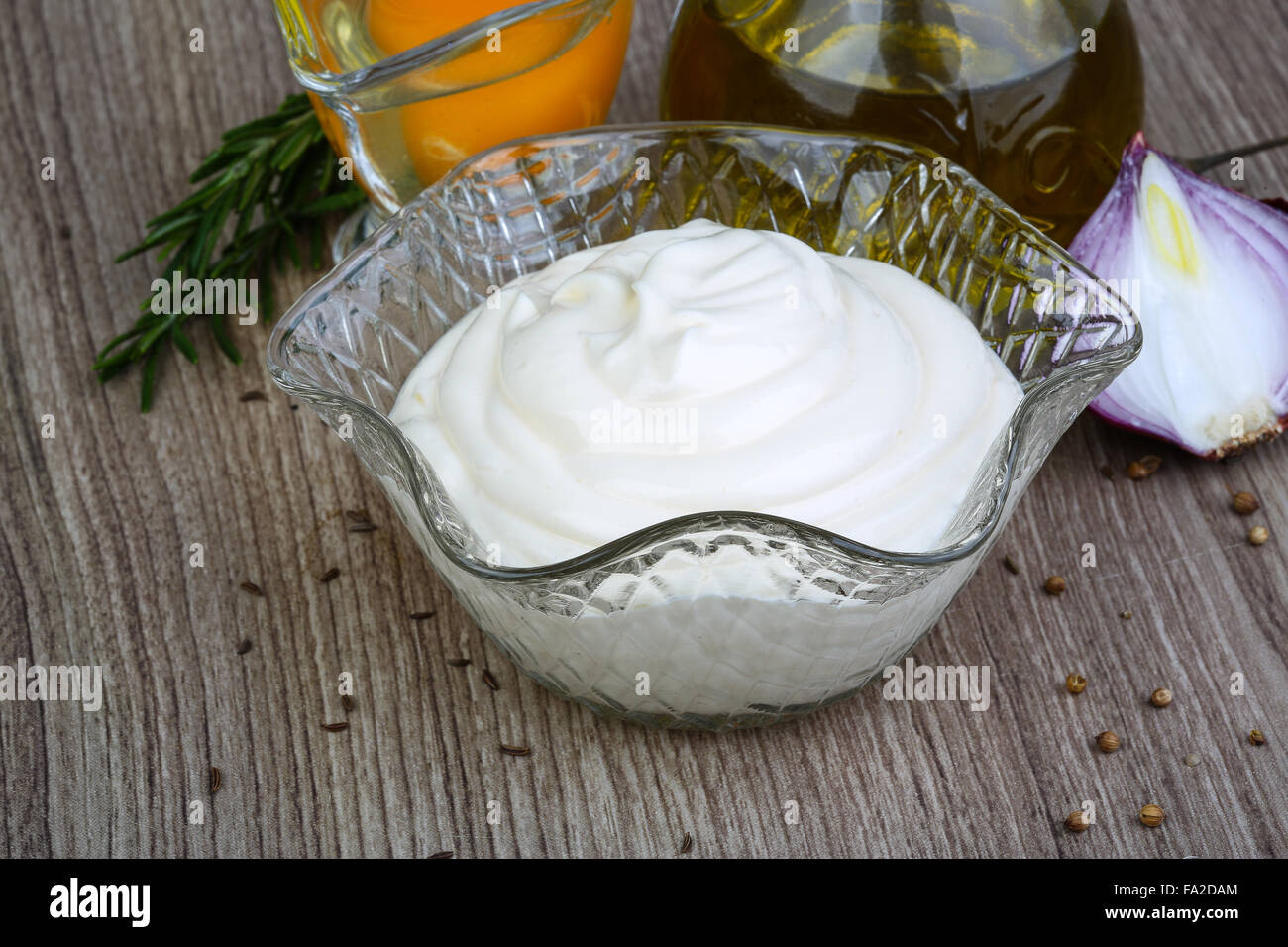 Mayonnaise sauce served raw egg, olive oil and rosemary Stock Photo Alamy