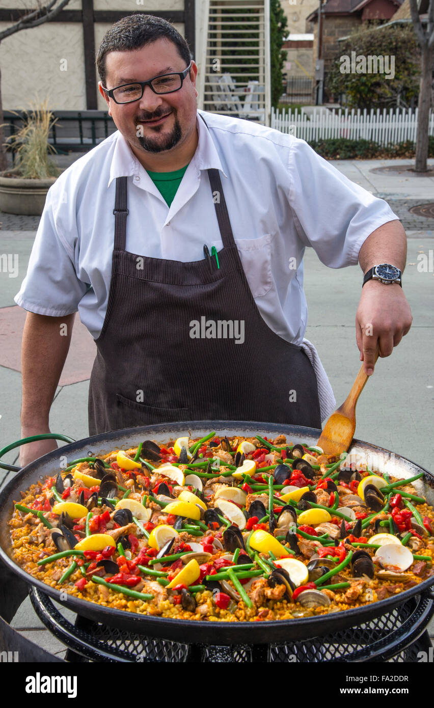 Basque Market, Chief Cook Jake Arrepondo preparing' Paella' Spains Most Famous Meal on Iconic Pan for Lunch, Boise, Idaho Stock Photo