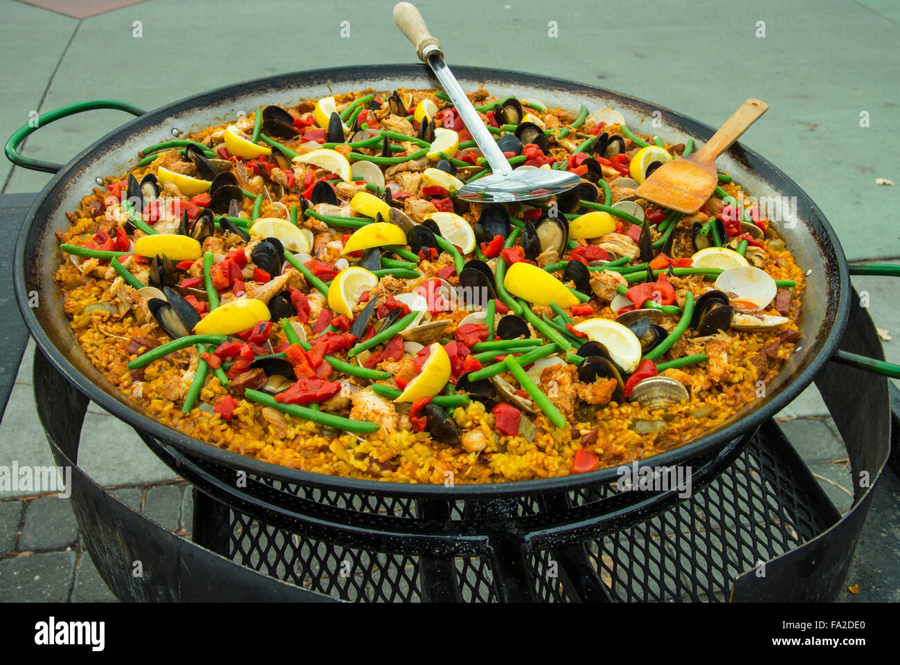 BASQUE MARKET, ICONIC PAN of Spains most famous meal of colorful 'Paella' prepared by Chief for outdoor lunch, Boise, Idaho, USA Stock Photo