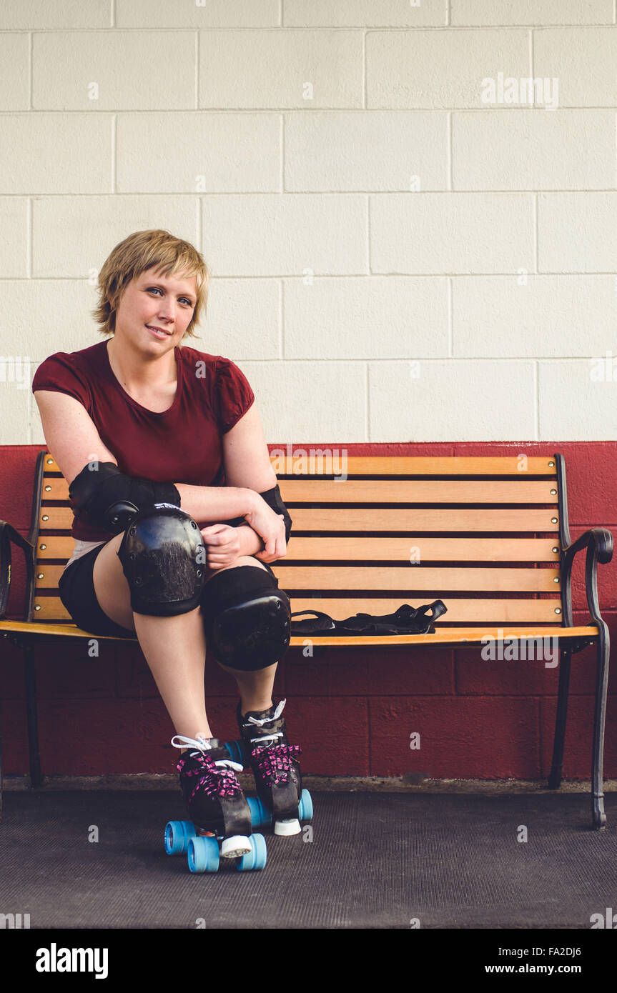 Roller derby, roller skating woman outside of roller rink with roller