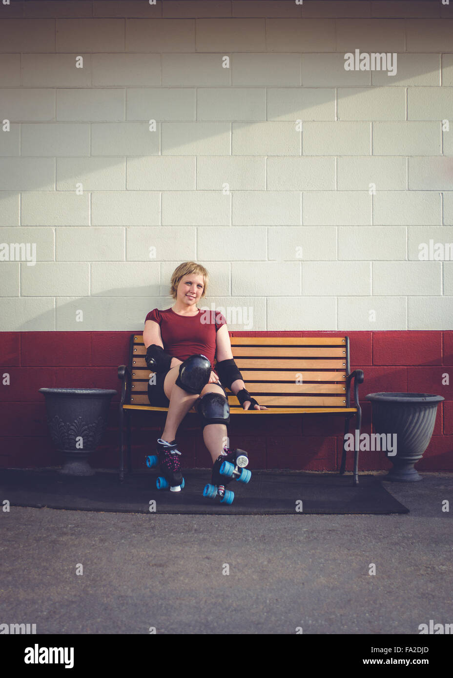 Roller derby, roller skating woman outside of roller rink with roller