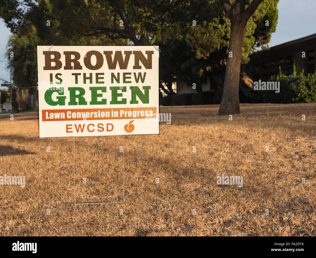 Brown is the New Green sign Stock Photo - Alamy
