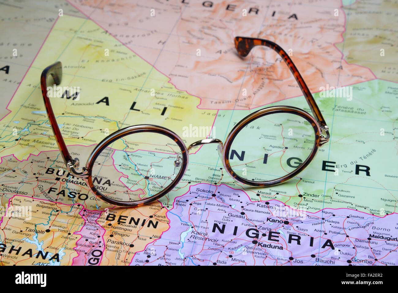 Glasses on a map - Niamey Stock Photo