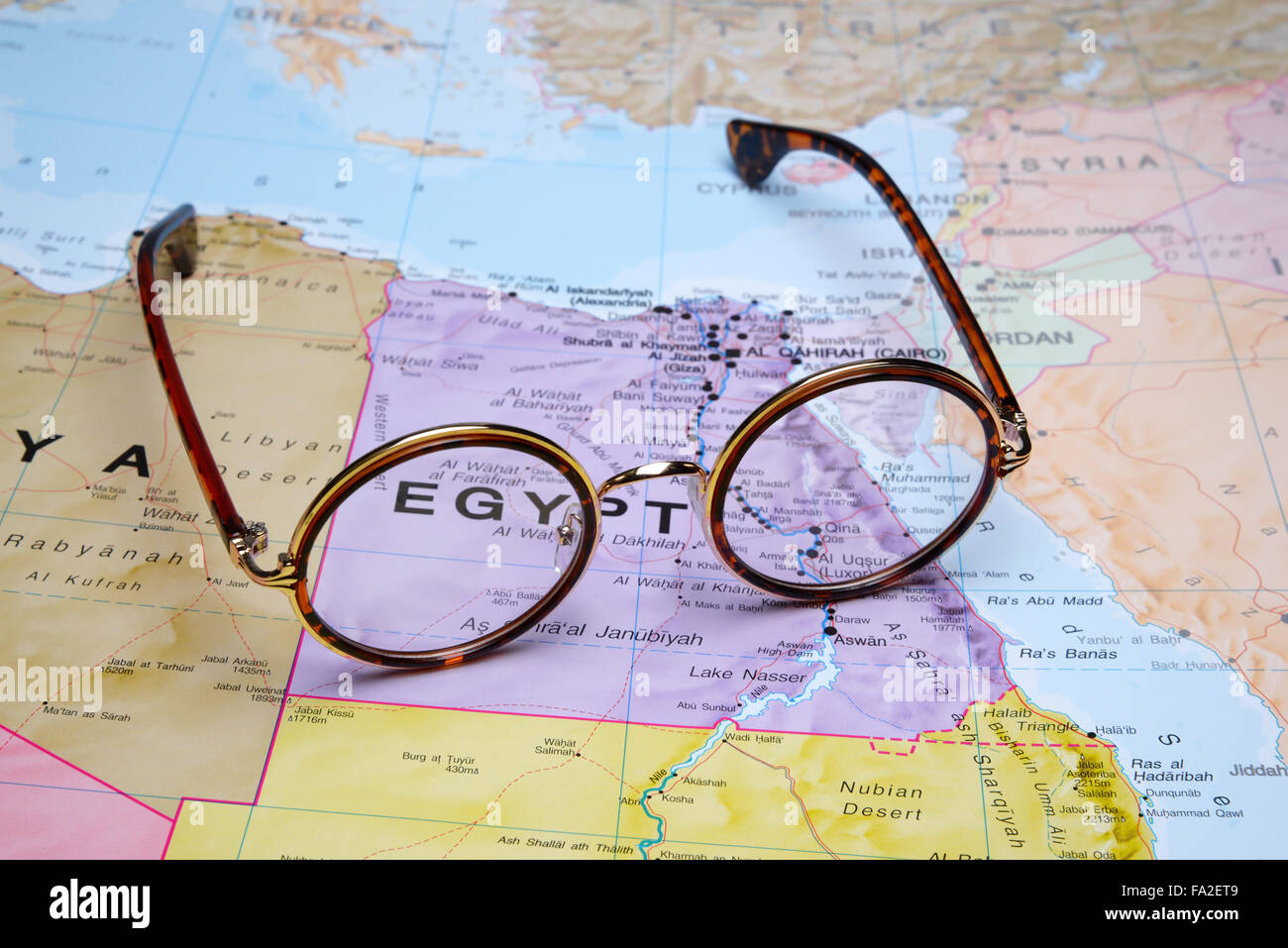 Glasses on a map Egypt Stock Photo Alamy