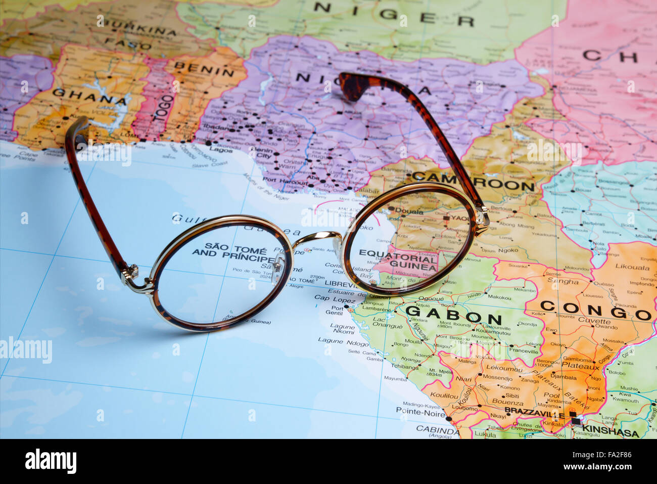Glasses on a map - Equatorial Guinea Stock Photo